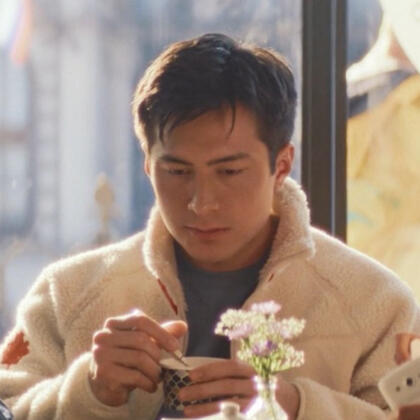 an image of bobby nash from 9-1-1 with a lesbian flag overlay